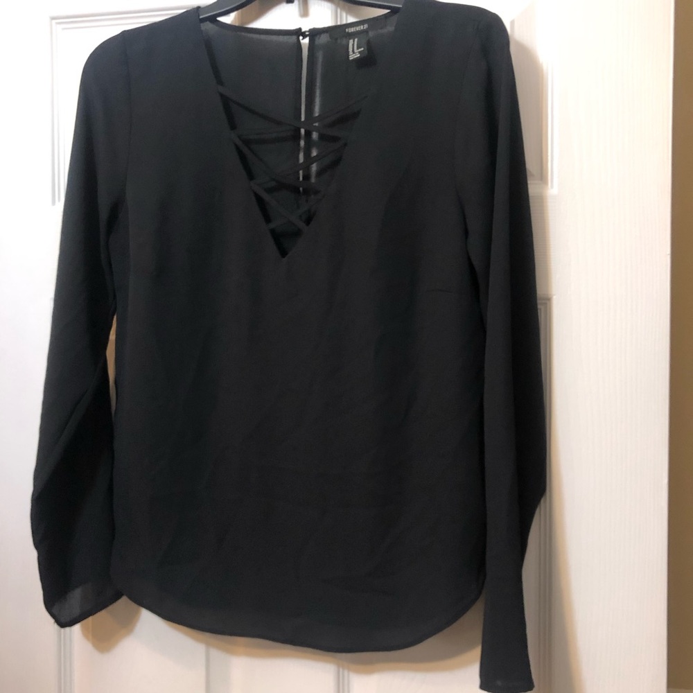 Forever 21 black blouse with cris-cross design in the front and keyhole closure